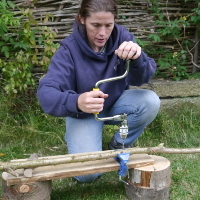 carpenters brace to drill through a pole