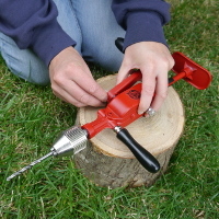 changing handle on rotary hand drill with chest plate