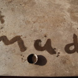 mud writing on floor