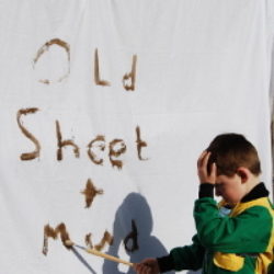 mud writing on tarp