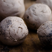 clay balls with patterns scratched into them