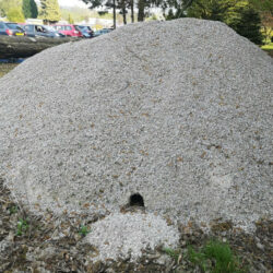 hole in base of pile of gravel