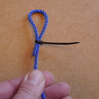 small cable tie used to create a loop in a piece of string
