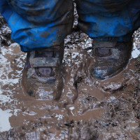 standing in a very muddy puddle