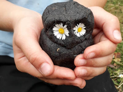 Mud dough owl in hands 40x40