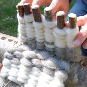 Weaving on a rustic peg loom